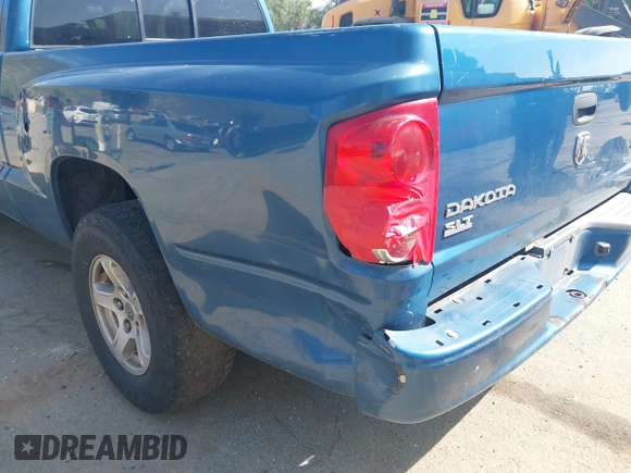 2005 Dodge Dakota SLT with VIN 1D7HE42N85S194847, listed as a IAAI auction lot 41880048 with 289,575 mi miles and . Bid and sale history available at DreamBid. Image 6.