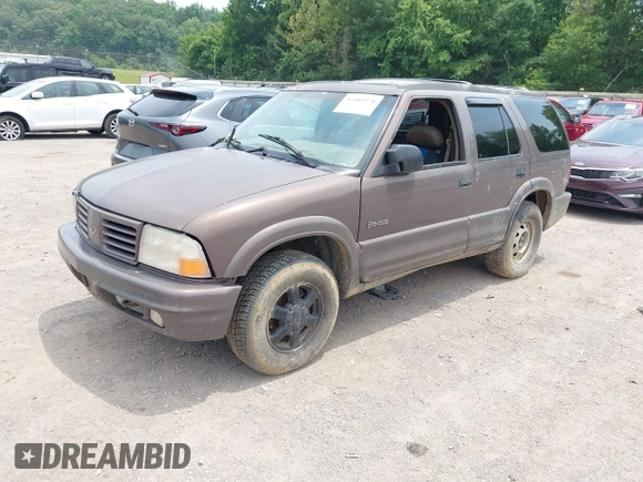 1999 Oldsmobile Bravada z VIN 1GHDT13W3X2710047, wystawiony jako IAAI lot #42481978 z przebiegiem Nie podano mil oraz . Historia ofert i sprzedaży dostępna na DreamBid. Obrazek 2.