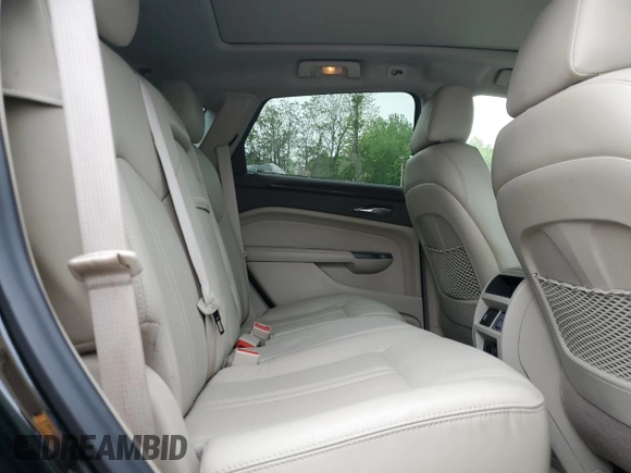 2015 Cadillac SRX Luxury Collection z VIN 3GYFNEE33FS574163, wystawiony jako Copart lot #56667985 z przebiegiem 103 697 mil mil oraz Szkody całkowita. Historia ofert i sprzedaży dostępna na DreamBid. Obrazek 11.