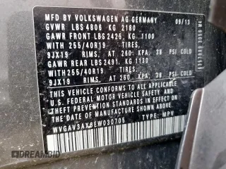 2014 Volkswagen Tiguan SEL z VIN WVGAV3AX6EW030705, wystawiony jako Copart lot #52156805 z przebiegiem 142 377 mil mil oraz Szkoda całkowita • Salvage title. Historia ofert i sprzedaży dostępna na DreamBid. Obrazek 14.