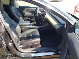2019 Tesla Model 3 Mid Range with VIN 5YJ3E1EA3KF304286, listed as a IAAI auction lot 42066908 with 164,667 mi miles. Bid and sale history available at carsss.com. Image 5.
