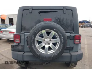 2014 Jeep Wrangler Unlimited Sport with VIN 1C4BJWDG4EL319259, listed as a IAAI auction lot 41494299 with 141,699 mi miles. Bid and sale history available at carsss.com. Image 16.