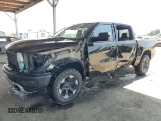 2019 Ram 1500 Rebel with VIN 1C6SRFLT1KN584123, listed as a Copart auction lot 62411645 with 57,606 mi miles and Salvage title. Bid and sale history available at DreamBid. Image 1.