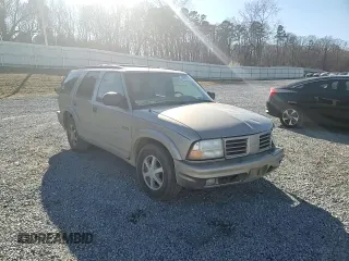 2000 Oldsmobile Bravada z VIN 1GHDT13W1Y2225360, wystawiony jako Copart lot #42967155 z przebiegiem 231 720 mil mil oraz Szkody całkowita. Historia ofert i sprzedaży dostępna na DreamBid. Obrazek 11.