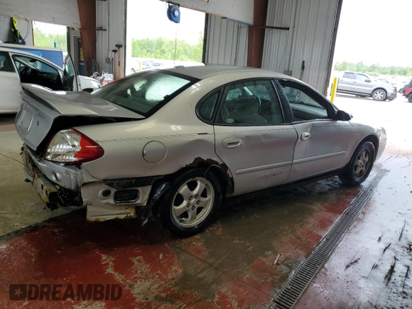 2005 Ford Taurus SE with VIN 1FAFP53215A133518, listed as a Copart auction lot 59615205 with 127,778 mi miles and Salvage title. Bid and sale history available at DreamBid. Image 3.