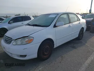 2004 Toyota Corolla CE with VIN JTDBR32E042025208, listed as a IAAI auction lot 41934485 with 299,999 mi miles. Bid and sale history available at carsss.com. Image 2.
