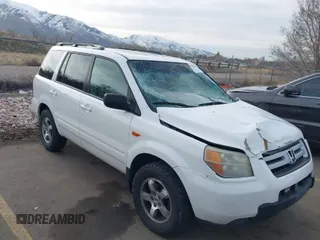 2006 Honda Pilot EX-L with VIN 2HKYF18576H517590, listed as a IAAI auction lot 41802601 with 233,833 mi miles and . Bid and sale history available at carsss.com. Image 1.