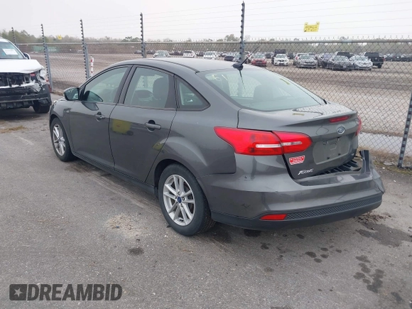 2017 Ford Focus SE with VIN 1FADP3F22HL299398, listed as a IAAI auction lot 41162384 with 121,993 mi miles and . Bid and sale history available at DreamBid. Image 3.