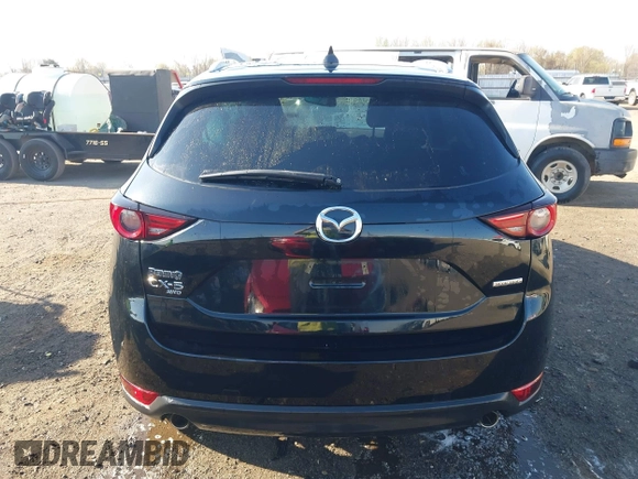 2020 Mazda CX-5 Grand Touring with VIN JM3KFBDM0L0790508, listed as a IAAI auction lot 41883319 with 114,398 mi miles and . Bid and sale history available at carsss.com. Image 16.