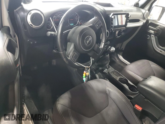 2013 Jeep Wrangler Rubicon 10th Anniversary z VIN 1C4BJWCGXDL543958, wystawiony jako Copart lot #58492255 z przebiegiem 94 455 mil mil oraz Szkoda całkowita • Salvage title. Historia ofert i sprzedaży dostępna na DreamBid. Obrazek 8.