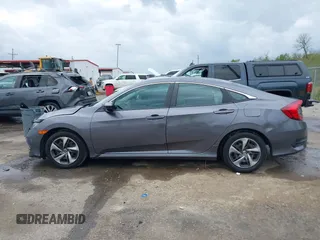 2019 Honda Civic LX with VIN 19XFC2F68KE007409, listed as a IAAI auction lot 41887406 with 57,147 mi miles and . Bid and sale history available at DreamBid. Image 14.
