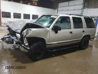 1999 GMC Yukon with VIN 1GKEK13R1XJ740648, listed as a Copart auction lot 82829084 with 211,002 mi miles and Salvage Title. Bid and sale history available at carsss.com. Image 1.