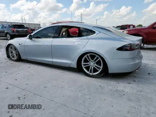2013 Tesla Model S with VIN 5YJSA1CG5DFP03704, listed as a Copart auction lot 65143565 with Not provided miles and Clean title. Bid and sale history available at DreamBid. Image 2.