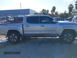 2018 Toyota Tacoma SR with VIN 3TMCZ5AN6JM185891, listed as a IAAI auction lot 41450665 with 53,749 mi miles and . Bid and sale history available at DreamBid. Image 14.