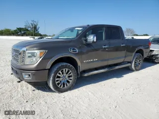 2016 Nissan Titan XD Platinum Reserve with VIN 1N6BA1F21GN506919, listed as a Copart auction lot 52977235 with 134,751 mi miles and Salvage Title. Bid and sale history available at carsss.com. Image 1.