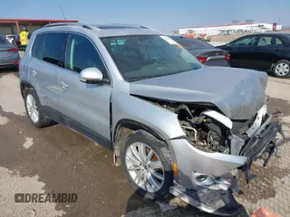 2011 Volkswagen Tiguan SE with VIN WVGBV7AX2BW562055, listed as a IAAI auction lot 41642084 with 175,407 mi miles and . Bid and sale history available at DreamBid. Image 1.