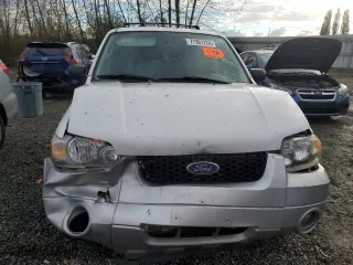 2005 Ford Escape Hybrid with VIN 1FMCU95H95KC74177, listed as a Copart auction lot 77361724 with 195,199 mi miles and Salvage Title. Bid and sale history available at carsss.com. Image 5.