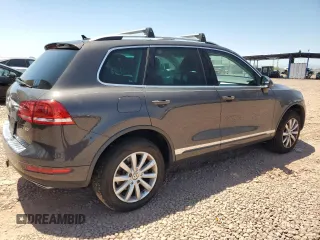 2012 Volkswagen Touareg Sport z VIN WVGFK9BPXCD003600, wystawiony jako Copart lot #61783705 z przebiegiem 171 598 mil mil oraz Czysty tytuł • Clean title. Historia ofert i sprzedaży dostępna na DreamBid. Obrazek 3.