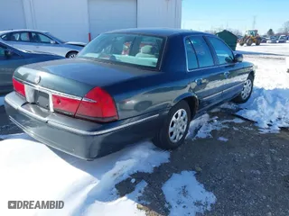 1998 Mercury Grand Marquis GS with VIN 2MEFM74W7WX648255, listed as a IAAI auction lot 41594158 with 108,527 mi miles. Bid and sale history available at carsss.com. Image 4.