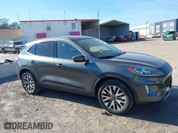 2020 Ford Escape Titanium with VIN 1FMCU9J9XLUA66440, listed as a IAAI auction lot 41464049 with 57,626 mi miles and . Bid and sale history available at DreamBid. Image 13.