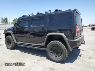 2005 Hummer H2 SUV z VIN 5GRGN23U05H117630, wystawiony jako Copart lot #57087305 z przebiegiem 60 260 mil mil oraz Szkoda całkowita • Salvage title. Historia ofert i sprzedaży dostępna na DreamBid. Obrazek 2.