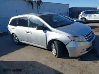 2011 Honda Odyssey Touring with VIN 5FNRL5H9XBB012899, listed as a IAAI auction lot 41611879 with 171,041 mi miles. Bid and sale history available at carsss.com. Image 6.