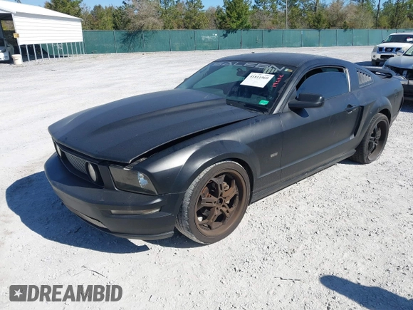 2005 Ford Mustang Deluxe with VIN 1ZVFT80N655136118, listed as a IAAI auction lot 41811969 with 104,071 mi miles. Bid and sale history available at carsss.com. Image 2.