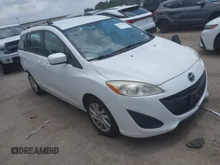 2012 Mazda 5 Sport z VIN JM1CW2BLXC0114770, wystawiony jako IAAI lot #42147656 z przebiegiem 99 908 mil mil oraz . Historia ofert i sprzedaży dostępna na DreamBid. Obrazek 1.