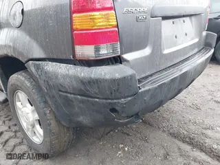 2004 Ford Escape XLT with VIN 1FMYU93134KA37307, listed as a IAAI auction lot 41514916 with 207,522 mi miles. Bid and sale history available at carsss.com. Image 6.