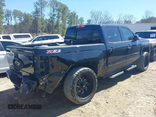 2017 Chevrolet Silverado 1500 LT with VIN 3GCUKREC1HG358752, listed as a IAAI auction lot 41775110 with 150,528 mi miles and . Bid and sale history available at DreamBid. Image 4.