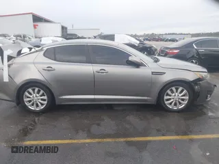 2014 Kia Optima EX z VIN 5XXGN4A75EG290132, wystawiony jako IAAI lot #41292706 z przebiegiem 155 793 mil mil oraz . Historia ofert i sprzedaży dostępna na DreamBid. Obrazek 13.