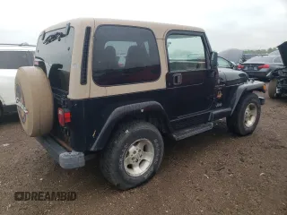 2000 Jeep Wrangler Sahara z VIN 1J4FA59S2YP714136, wystawiony jako Copart lot #57635845 z przebiegiem 178 075 mil mil oraz Czysty tytuł • Clean title. Historia ofert i sprzedaży dostępna na DreamBid. Obrazek 3.