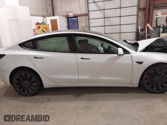 2021 Tesla Model 3 Performance with VIN 5YJ3E1ECXMF991836, listed as a IAAI auction lot 41830519 with Not Provided miles and . Bid and sale history available at carsss.com. Image 13.