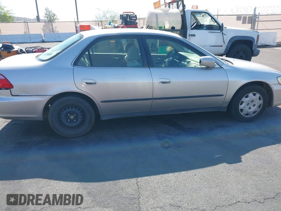 1999 Honda Accord LX with VIN JHMCG6650XC011621, listed as a IAAI auction lot 42401527 with 243,227 mi miles and . Bid and sale history available at DreamBid. Image 12.