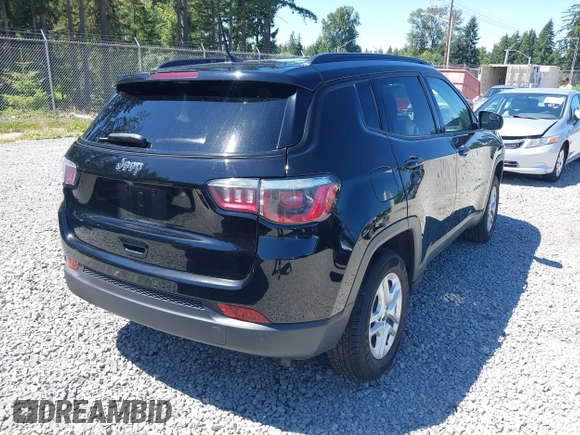 2018 Jeep Compass Sport with VIN 3C4NJDAB1JT261863, listed as a IAAI auction lot 42677037 with 93,263 mi miles and . Bid and sale history available at DreamBid. Image 4.