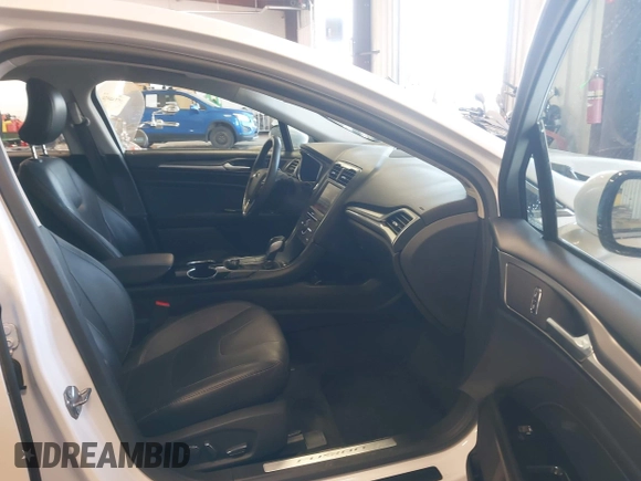 2016 Ford Fusion Titanium z VIN 3FA6P0D93GR116355, wystawiony jako IAAI lot #42158991 z przebiegiem 59 602 mil mil oraz . Historia ofert i sprzedaży dostępna na DreamBid. Obrazek 5.