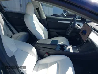 2022 Tesla Model 3 with VIN 5YJ3E1EAXNF326354, listed as a IAAI auction lot 41651872 with 27,922 mi miles and . Bid and sale history available at DreamBid. Image 5.
