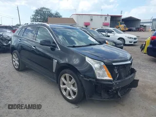 2014 Cadillac SRX Premium Collection z VIN 3GYFNDE31ES587132, wystawiony jako IAAI lot #41711346 z przebiegiem 127 381 mil mil oraz . Historia ofert i sprzedaży dostępna na DreamBid. Obrazek 1.