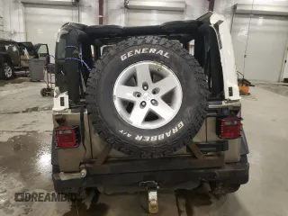 2004 Jeep Wrangler Rubicon z VIN 1J4FA69S44P784141, wystawiony jako Copart lot #55235305 z przebiegiem 125 564 mil mil oraz Szkoda całkowita • Salvage title. Historia ofert i sprzedaży dostępna na DreamBid. Obrazek 6.