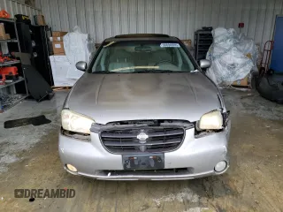 2001 Nissan Maxima SE z VIN JN1CA31A21T309782, wystawiony jako Copart lot #56696605 z przebiegiem 312 094 mil mil oraz Szkody całkowita. Historia ofert i sprzedaży dostępna na DreamBid. Obrazek 5.