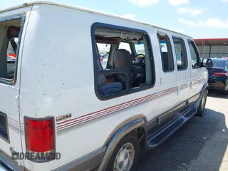 1999 Ford Econoline Cargo Recreational with VIN 1FDRE14L2XHA41059, listed as a IAAI auction lot 42067879 with 149,185 mi miles. Bid and sale history available at carsss.com. Image 20.