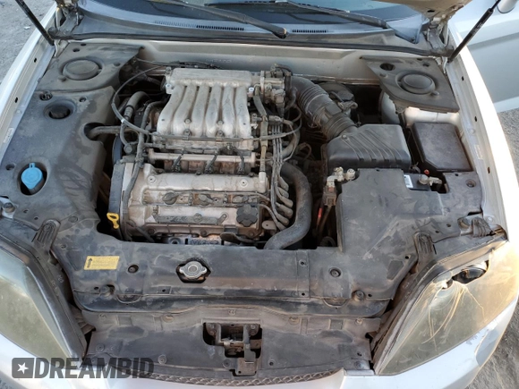 2005 Hyundai Tiburon GT z VIN KMHHN65F05U171038, wystawiony jako Copart lot #87765735 z przebiegiem 113 129 mil mil oraz Szkoda całkowita • Salvage title. Historia ofert i sprzedaży dostępna na DreamBid. Obrazek 12.