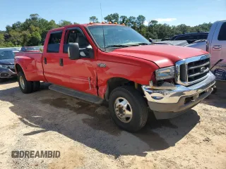 2003 Ford F-350 XL with VIN 1FTWW33P63EC65547, listed as a Copart auction lot 73002754 with 184,482 mi miles and Salvage Title. Bid and sale history available at DreamBid. Image 4.