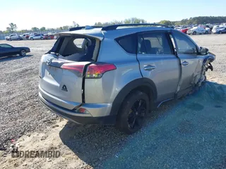 2018 Toyota RAV4 XLE with VIN 2T3RFREVXJW748993, listed as a IAAI auction lot 41878888 with 111,760 mi miles and . Bid and sale history available at DreamBid. Image 4.