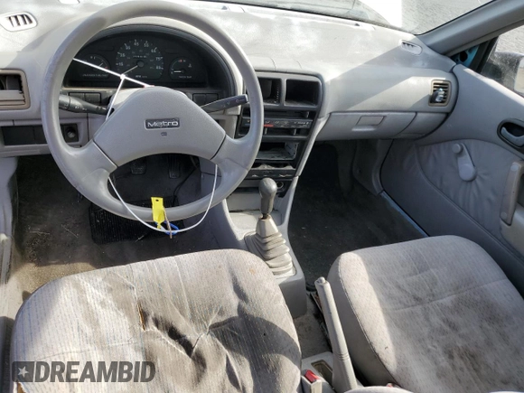 1992 Geo Metro z VIN 2C1MS2465N6782913, wystawiony jako Copart lot #77405574 z przebiegiem 77 080 mil mil oraz Szkody całkowita. Historia ofert i sprzedaży dostępna na DreamBid. Obrazek 8.