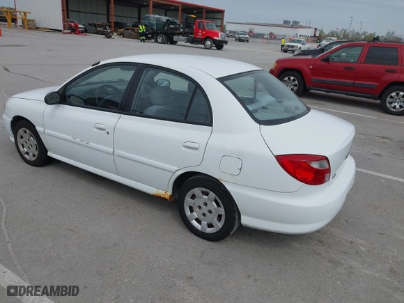 2002 Kia Rio with VIN KNADC123926185376, listed as a IAAI auction lot 42027348 with 84,893 mi miles. Bid and sale history available at carsss.com. Image 3.