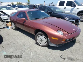 1986 Porsche 928 z VIN WP0JB0924GS860517, wystawiony jako Copart lot #58575324 z przebiegiem 105 961 mil mil oraz Szkody całkowita. Historia ofert i sprzedaży dostępna na DreamBid. Obrazek 4.