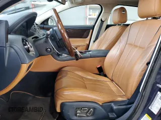 2015 Jaguar XJ Portfolio with VIN SAJWJ2GD2F8V90287, listed as a Copart auction lot 50291095 with 46,917 mi miles and Salvage title. Bid and sale history available at DreamBid. Image 7.