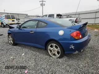 2004 Hyundai Tiburon GT z VIN KMHHN65F04U116166, wystawiony jako Copart lot #51525065 z przebiegiem 153 035 mil mil oraz Szkody całkowita. Historia ofert i sprzedaży dostępna na DreamBid. Obrazek 2.