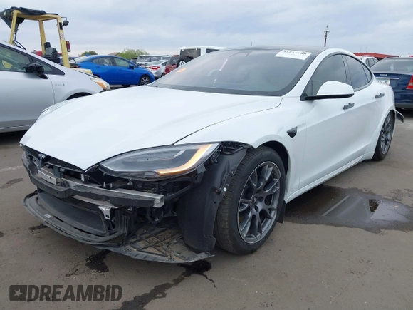 2021 Tesla Model S Long Range with VIN 5YJSA1E57MF453815, listed as a IAAI auction lot 41818700 with 51,176 mi miles and . Bid and sale history available at DreamBid. Image 2.